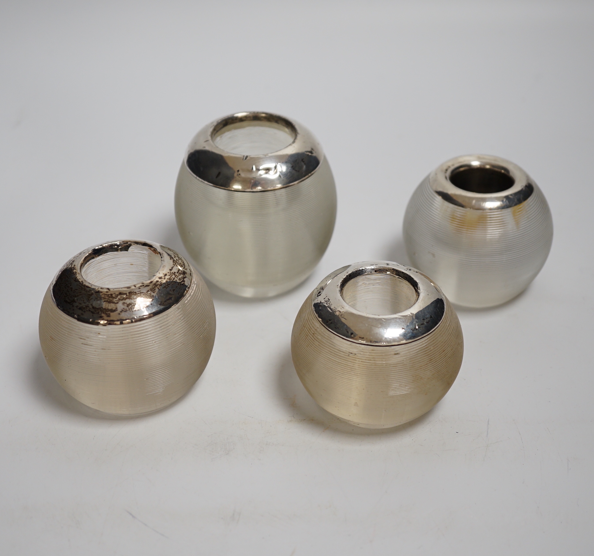 Four assorted silver match glass match strikes, tallest 76mm, marks rubbed.